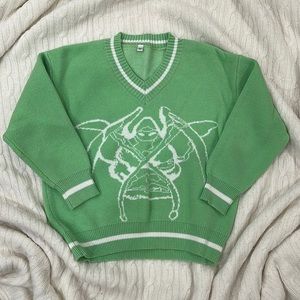 green v neck sweater with graphic